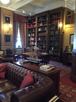 Tall Oak bookshelves with brass rail and ladder