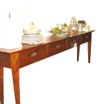 Console with tapered legs and deep drawers