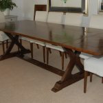 Cross leg table with feet, shown with a removable extension