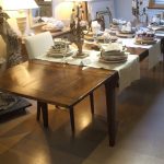 Dining table with slide under extensions